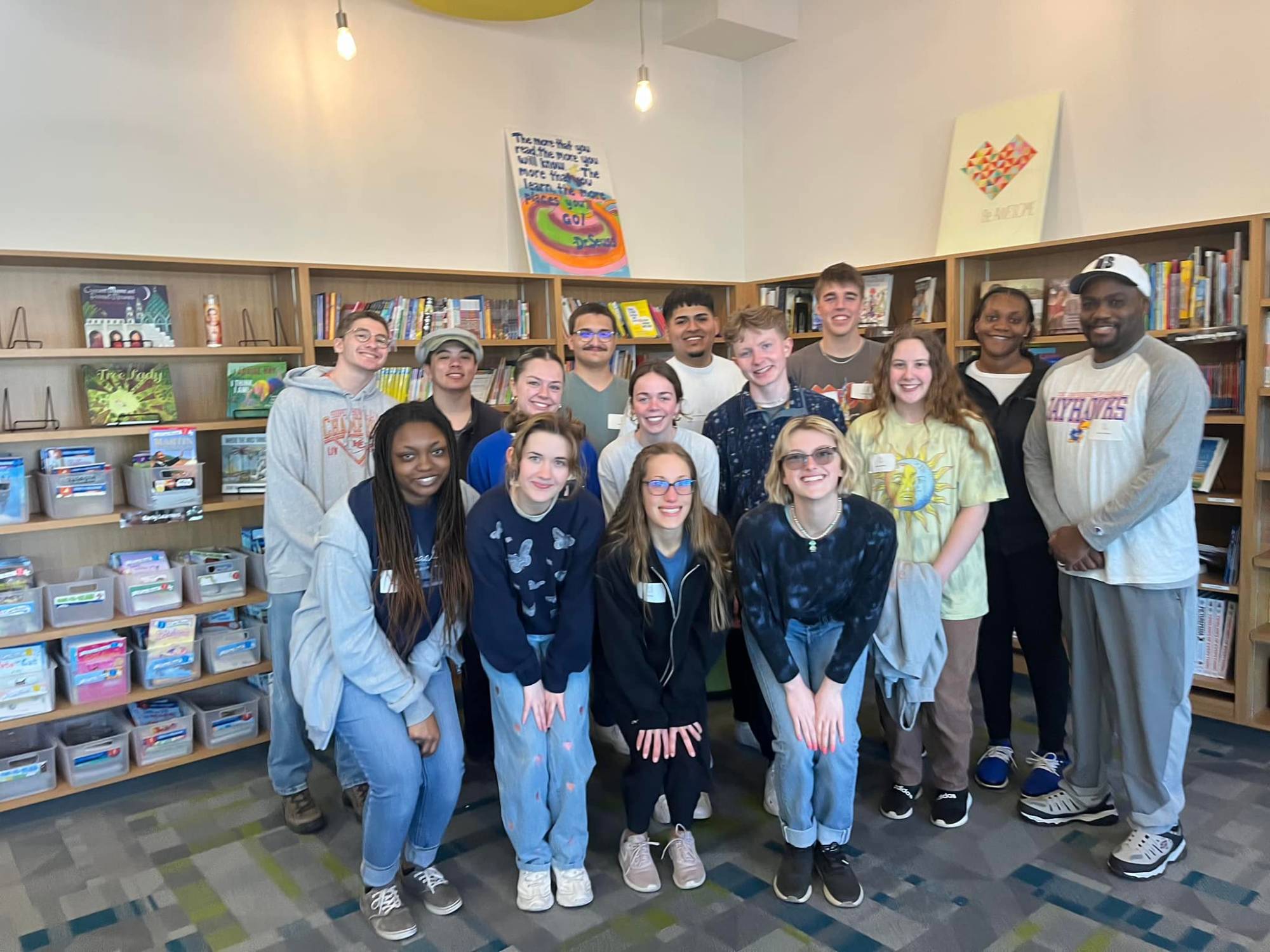 SLAM trip group photo with Quincy Williams and students